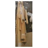 PILE OF UNFINISHED PINE MOLDING / TRIM