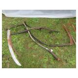 PILE OF SCYTHES, SAW BLADE