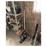 PILE OF FISHING POLES w/ NET