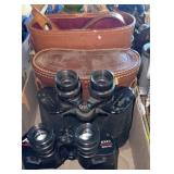 Two pairs of binoculars with leather cases
