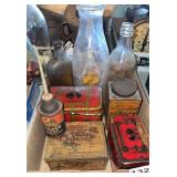 Box of milk and other bottles and tin advertising