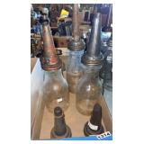Three oil bottles, two extra spouts