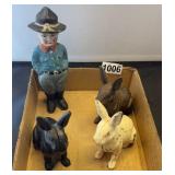 3 cast iron bunnies and man