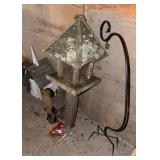Four birdfeeders and a shepherd hook