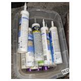 2 totes of new and used caulk