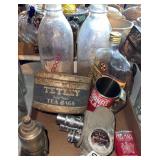 Lots of advertising milk bottles, cans, tobacco