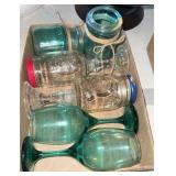 Two boxes, wine, glasses, and jars