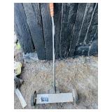Rolling magnet for picking up nails, etc