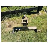 Trailer hitch attachment for a tractor