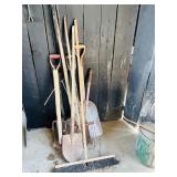 Assortment of shovels, pitch forks, rakes, sledge