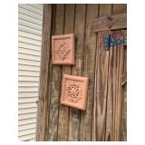 (2) Terra Cotta Décor - Located on Shed