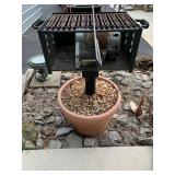 Charcoal BBQ Grill in Planter - Located on Patio