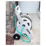 Garden hose & reel      Located Back Patio