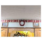 Group of fruit wall décor around kitchen, see all