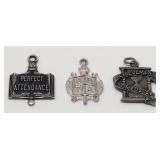 Three Sterling Silver Award Charms; 6.8 Grams