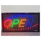 Multicolored "Open" Sign