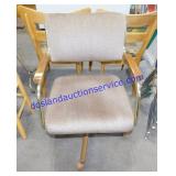Brown Upholstered Swivel Chair on Wheels