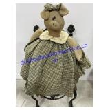 Decorative Pig on Decorative Metal Chair