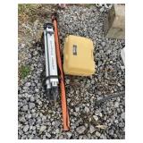 Transit with tripod and measuring stick, tag 408