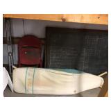 Wood framed chalkboard and folding chair, level,