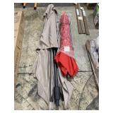 Two patio umbrellas one missing pool