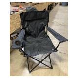 Black folding chair with carrying bag