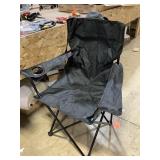 Black folding chair with carrying bag