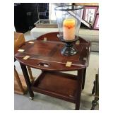 Serving cart with drop leaf and decorative vase,
