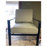 Outdoor Metal Arm Chair Has Bent Back Leg