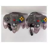 LOT OF TWO NINTENDO N64 CONTROLLERS - ATOMIC