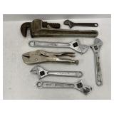 LOT OF ADJUSTABLE WRENCHES AND 14' PIPE WRENCH