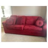 RED UPHOLSTERED HIDE A BED COUCH - 85' LONG