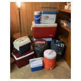LARGE LOT OF COOLERS AND COLEMAN SLEEPING BAG