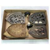 LARGE LOT OF CAST IRON TRIVETS AND PORCELAIN DOOR