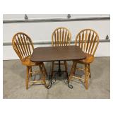 3 WOODEN BAR STOOLS AND TABLE WITH WROUGHT IRON