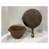 UNMARKED CAST IRON SKILLET AND UNMARKED 3 FOOTED