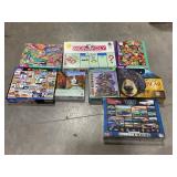 LARGE LOT OF ASSORTED PUZZLES & MONOPOLY BOARD