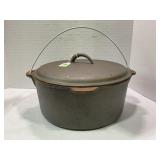 UNMARKED CAST IRON DEEP FRYER WITH LID & STRAINER