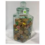 GLASS BEVERAGE DISPENSER FULL OF VINTAGE WOOD