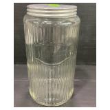 SELLERS GLASS RIBBED JAR WITH ORIGINAL LID -7 3/4"