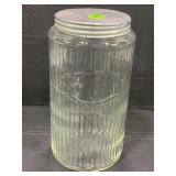 SELLERS GLASS RIBBED JAR WITH ORIGINAL LID -7 3/4"
