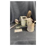 Assortment of vintage car tools and emblems