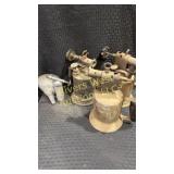Three Antique blow torches and a small grease gun