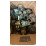Box full of glass insulators of various sizes and