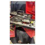 Two tool boxes filled with sockets wrenches and