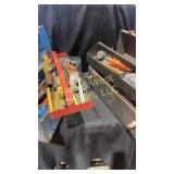 Two metal tool boxes filled with tools