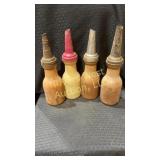 Four vintage plastic 1-quart motor oil bottle