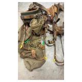 Four sets of climbing hooks and a belt