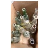 Box of vintage pop and beer bottles including