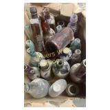 Box full of glass bottles appears to be